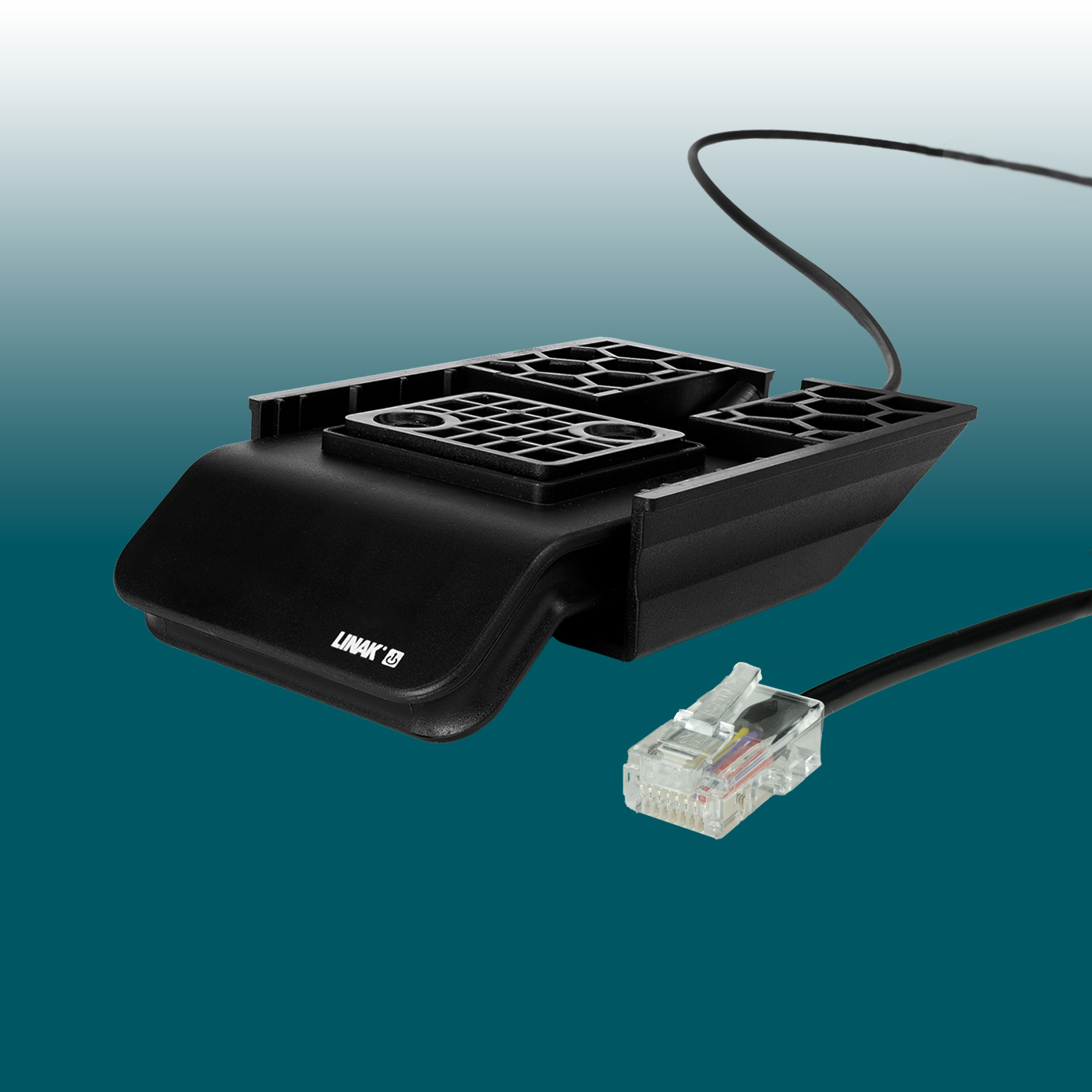 Black, ergonomically shaped housing with the Linak logo. Several grid-shaped mounting points on the top. A thin cable extends from the unit, whilst a thicker cable is located at the front with a transparent RJ45 plug, ready for connection.